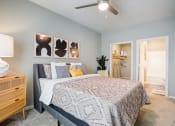 Thumbnail 30 of 42 - a bedroom with a bed and a ceiling fan