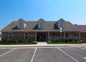 Thumbnail 1 of 17 - Exterior view of the clubhouse at Canterbury House Newburgh Apartments in Newburgh, IN