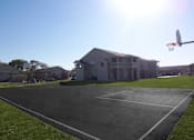 Thumbnail 10 of 25 - Basketball court in front of the clubhouse at Cobalt Apartments in Kokomo, Indiana