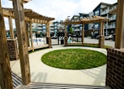 Thumbnail 32 of 34 - A small grassy area surrounded by wooden beams.