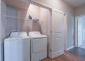 Thumbnail 21 of 25 - A washer and dryer in a small closet