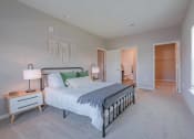 Thumbnail 19 of 25 - a bedroom with a bed and two night stands