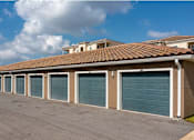 Thumbnail 16 of 34 - A row of garages at the Flats at Sundown in North Port, Florida