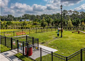 Thumbnail 10 of 34 - A dog park with obstacle course at the Flats at Sundown in North Port, Florida
