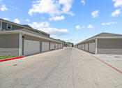Thumbnail 45 of 50 - A long row of garage doors are closed.