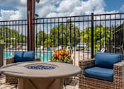 Thumbnail 7 of 34 - A fire pit with chairs at the Flats at Sundown in North Port, Florida