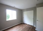 Thumbnail 10 of 17 - an empty room with a window and a door