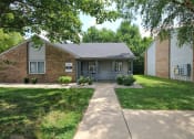 Thumbnail 1 of 17 - Hazelton Apartments Clubhouse exterior with a sidewalk
