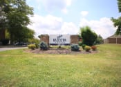 Thumbnail 3 of 17 - Large sign for Hazelton Apartments with plants around it
