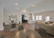 Thumbnail 24 of 24 - A modern living room with a dining table and chairs.