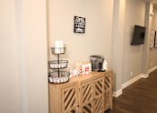 Thumbnail 20 of 20 - A wooden cabinet with a coffee sign on the wall above it.