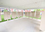 Thumbnail 19 of 34 - A white tent with a concrete floor and white walls.