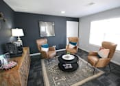 Thumbnail 4 of 25 - Community lounge room with a coffee maker, coffee table and chairs at Cobalt apartments in kokomo