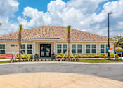 Thumbnail 1 of 34 - the exterior of the leasing office at the Flats at Sundown in North Port, Florida