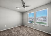 Thumbnail 19 of 58 - an empty room with two windows and a ceiling fan at
