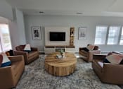 Thumbnail 31 of 58 - a living room with couches and a coffee table
