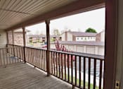 Thumbnail 6 of 11 - a view from a balcony with a wooden deck at Canterbury house apartments
