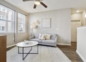 Thumbnail 16 of 22 - living room with a couch and a ceiling fan at The Lofts apartments in Slidell, LA