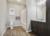 Thumbnail 20 of 22 - an empty bathroom with a toilet and a sink