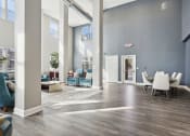Thumbnail 4 of 22 - Lobby with couches, chairs, and coffee tables at The Lofts in Slidell, LA