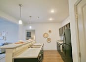 Thumbnail 16 of 31 - a kitchen with stainless steel appliances and granite counter tops