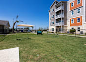 Thumbnail 8 of 31 - Dog park with a fence at Promenade apartments