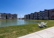 Thumbnail 10 of 31 - Pond with fountain at Promenade Luxury Apartments in Beaumont, TX