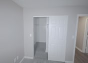 Thumbnail 14 of 18 - A white door is in the middle of a room.