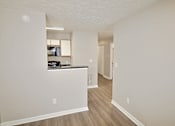 Thumbnail 7 of 18 - A kitchen area with a counter and cabinets.
