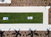 Thumbnail 55 of 83 - Two corn hole boards on a green lawn.