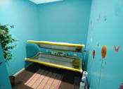 Thumbnail 15 of 15 - a room with a tanning bed at canterbury apartments in kalamazoo, mi