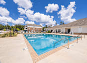 Thumbnail 18 of 33 - A large outdoor swimming pool with a metal railing.