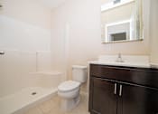 Thumbnail 10 of 12 - a bathroom with a sink toilet and shower