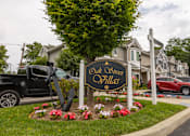 Thumbnail 2 of 12 - a sign for old oliver hills in front of a row of houses