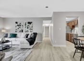 Thumbnail 3 of 28 - a spacious living room with gray walls and hardwood floors at Stonewater Apartments, Kentucky, 40241