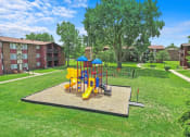 Thumbnail 12 of 14 - our apartments have a playground for kids at Hampton in Highland Apartments, Highland, Indiana