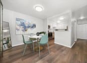 Thumbnail 3 of 14 - a dining room and kitchen with a table and chairs at Hampton in Highland Apartments, Highland