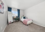 Thumbnail 7 of 14 - a bedroom with a bed and a mirror at Hampton in Highland Apartments, Indiana, 46322