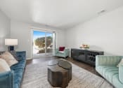 Thumbnail 2 of 14 - a living room with a blue couch and a sliding glass door at Hampton in Highland Apartments, Highland, IN, 46322