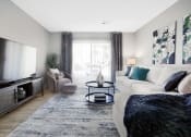 Thumbnail 7 of 28 - a living room with a white couch and a large tv at Stonewater Apartments, Kentucky