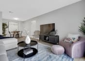 Thumbnail 6 of 28 - a living room with a couch a chair a coffee table and a tv at Stonewater Apartments, Kentucky, 40241