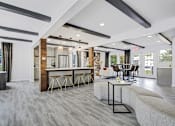 Thumbnail 25 of 31 - a resident lounge with couches chairs and a table at Southridge, Kansas City, KS, 66103