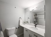 Thumbnail 13 of 25 - Bathroom With Vanity Lights at Rivers Edge Apartments, Waukesha