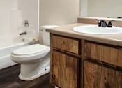Thumbnail 8 of 15 - a bathroom with a toilet sink and bathtub