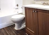 Thumbnail 15 of 20 - a small bathroom with a toilet sink and bathtub
