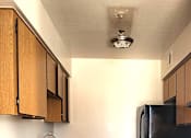 Thumbnail 7 of 20 - a kitchen with black appliances and wooden cabinets