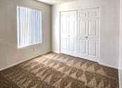 Thumbnail 9 of 20 - a bedroom with two closets and a window