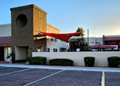 Thumbnail 2 of 20 - Leasing office with a red awning at sunrise