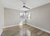 Thumbnail 8 of 64 - bedroom with ceiling fan at Ocean Breeze Terrace Apartment, Huntington Beach