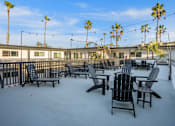 Thumbnail 52 of 64 - Deck with BBQ at Ocean Breeze Terrace Apartment, Huntington Beach
